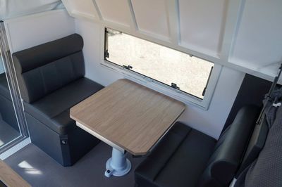 Folding top bunk above dinette 