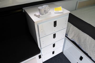 4X large drawers on drivers side interior wall.